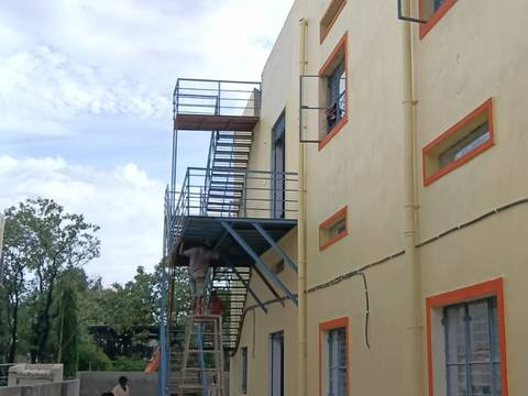 Completed building with an external steel staircase
