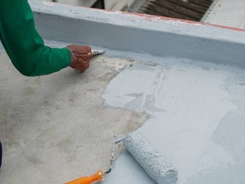 Waterproofing coat brushed along a terrace parapet wall